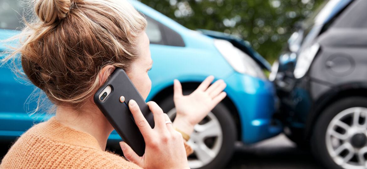 Female Motorist Involved In Car Accident Calling Insurance Company Or Recovery Service